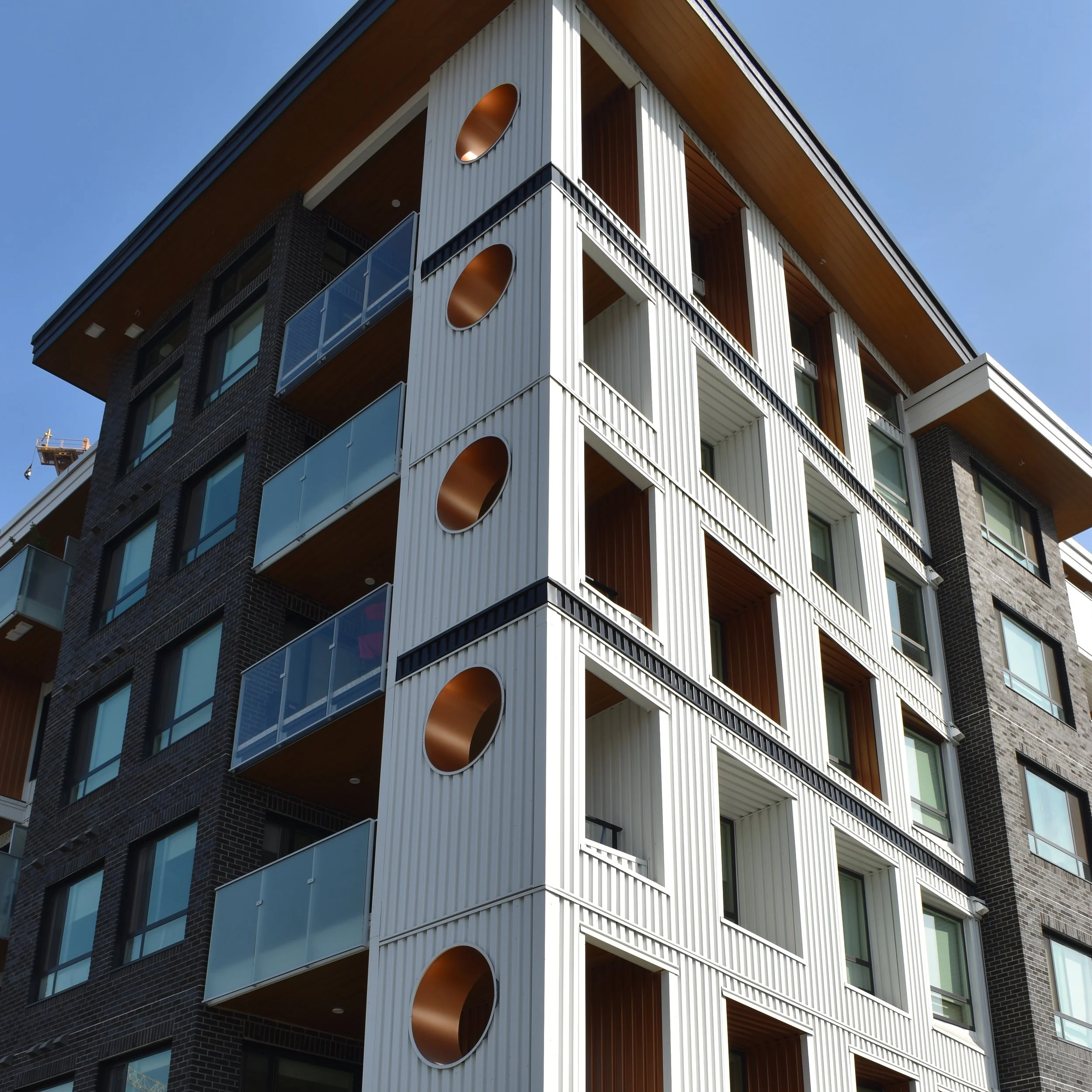Mid-rise exterior cladding installation using Hardie panels