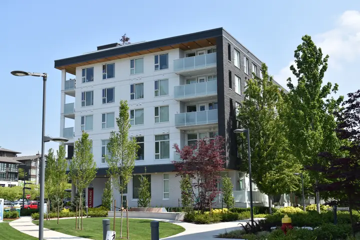 Lot E: mid-rise exterior cladding in Vancouver, BC by L2 Group — Hardie panel & lap siding